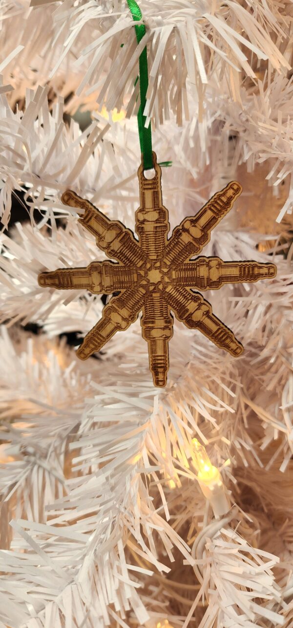 Spark plug snowflake in a christmas tree