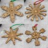 Set of 4 car themed snowflakes. They are in the shape of a set of shocks and rotors, wrenches, spark plugs and pistons.