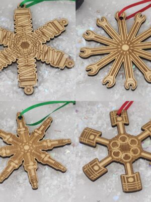 Set of 4 car themed snowflakes. They are in the shape of a set of shocks and rotors, wrenches, spark plugs and pistons.